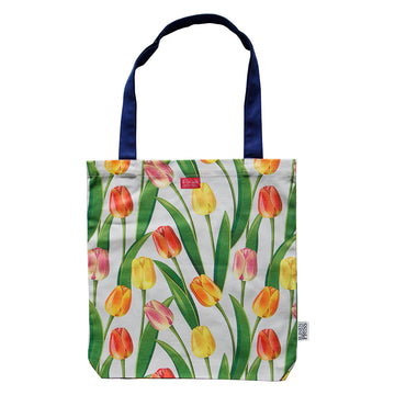 A tote bag with dark blue straps and printed with tulips.