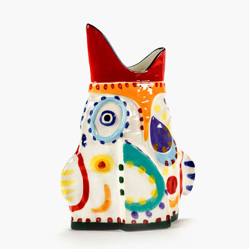 Colourful fish-shaped ceramic vase on a white background.