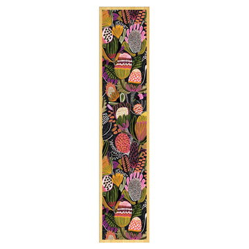 Decorative wooden bookmark with colorful floral pattern on a white background.