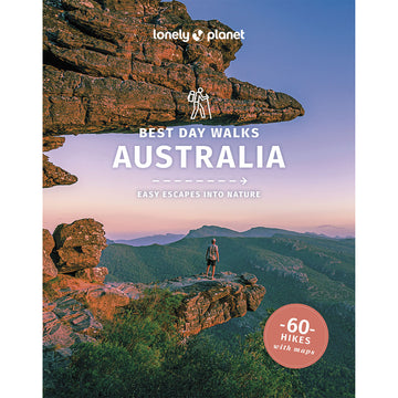 'Best Day Walks Australia' book cover feautring a photo of a man standing on a rocky ledge overlooking mountains.