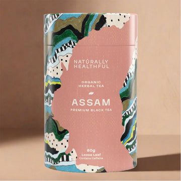 Tea packaging with colorful design and text on a beige background.