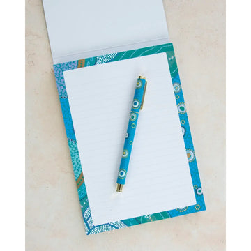 Writing pad with decorative cover in blue and green and 'earth greetings' branding