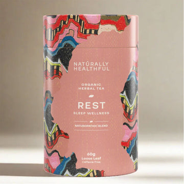 Tea canister with colorful design and text on a neutral background.