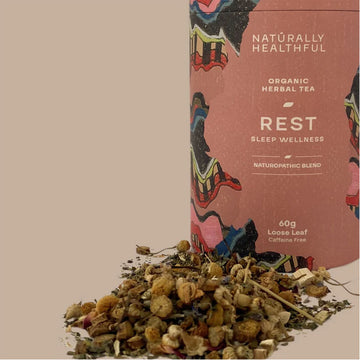 Tea canister with colorful design and text on a neutral background.