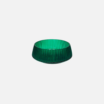 Green ribbed glass bowl on a white background.