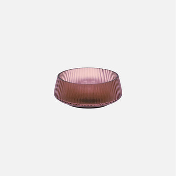 Pink glass bowl on a white background.