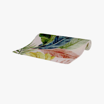 A tablecloth rolled up with colorful leaf pattern on a white background.