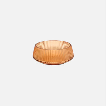 Glass bowl in orange on a white background.