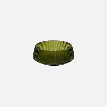 A green glass bowl on a white background.