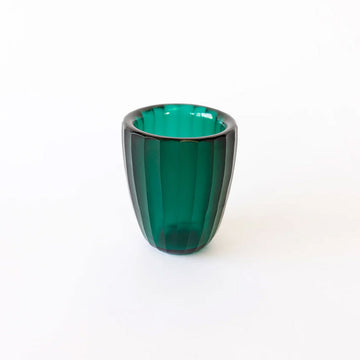 A glass beaker in green.
