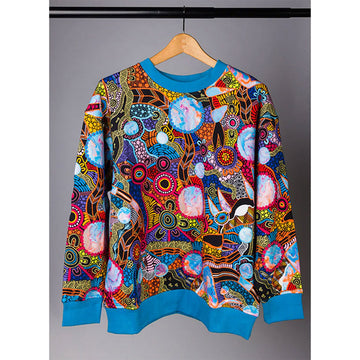 A jumper with blue ribbing at the collar, and hem lines and printed with colourful artwork by Justin Butler.