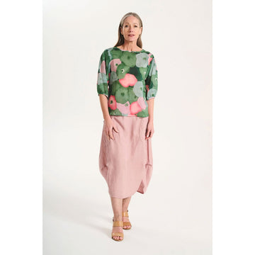 A pale pink skirt with side pockets against a white background.