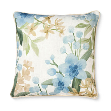 Floral-patterned pillow with blue flowers on a white background.