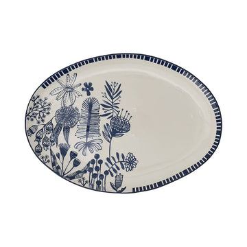A white ceramic platter illustrated with blue flowers  on the left side and a striped border.