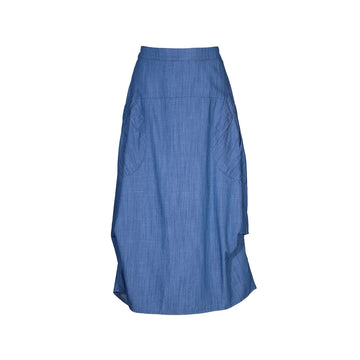 A skirt in a light denim blue with side pockets against a white background.
