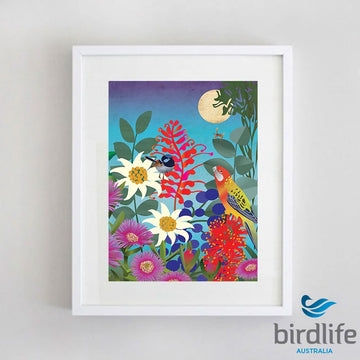 A framed print of an illustration of two birds sitting on a display of different flowers.