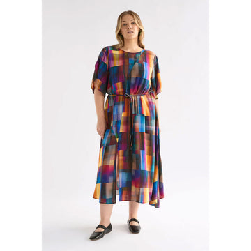 Colorful dress with a geometric pattern on a white background.