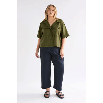 Green shirt with short sleeves on a white background.