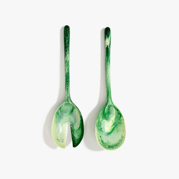 A pair of salad servers made from green resin.