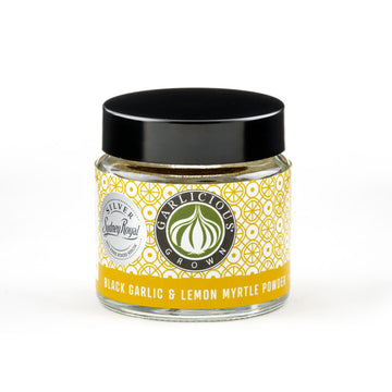 A clear jar with a wide product label and the title 'Black Garlic and Lemon Myrtle Powder'.