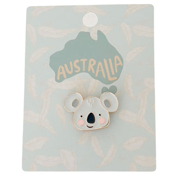 An enamel pin shaped like a koala's head attached to a card with the heading 'Australia' written on a map of Australia.