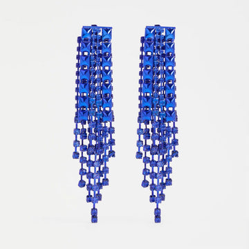 Pair of blue beaded earrings on a light grey background.