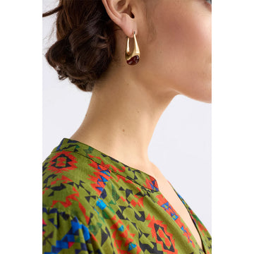 Pair of hoop earrings with silver tops and blue bottoms on a light gray background.