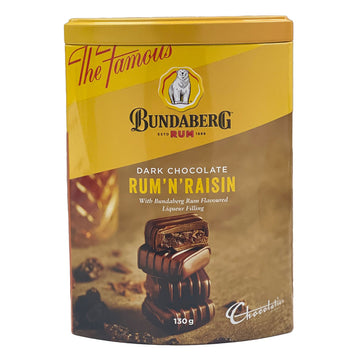 A tin titled 'Dark Chocolate Rum 'n' Raisin' with a photo of four square chocolates stacked up on top of each other.