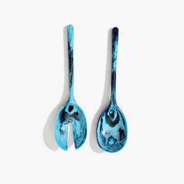 A pair of salad servers made from blue resin.