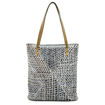 Tote bag with geometric black and white pattern and brown handles on a white background.