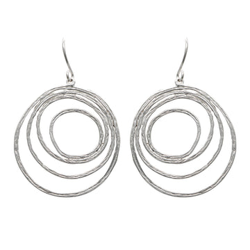 A pair of drop earrings featuring circles inside of each other in different sizes in silver.