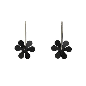A pair of drop earrings made from two propeller shapes layered over the top of each other in black.