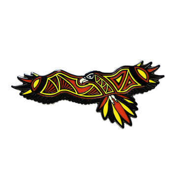 An enamel pin in the shape of an illustrated eagle in red and orange