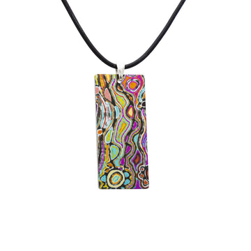 A rectangle pendant printed with artwork in different colours on a black cord.