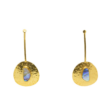 A pair of gold drop earrings with an irregular shaped circle at the bottom and a abalone stone in the middle.