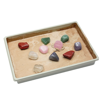 Front of the Gemstone Excavation Kit in purple with a photo of different gems in the middle.