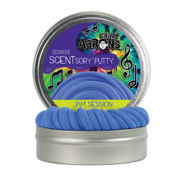A silver round container with the text 'Crazy Aaron's Scented Scentsory Putty Jam Session' with images of music notes. There is a second container in front showing the blue putty inside.