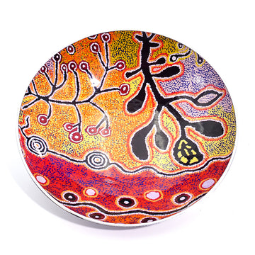 Top down view of a large salad bowl featuring artwork in black, red and yellow by Paddy Stewart.
