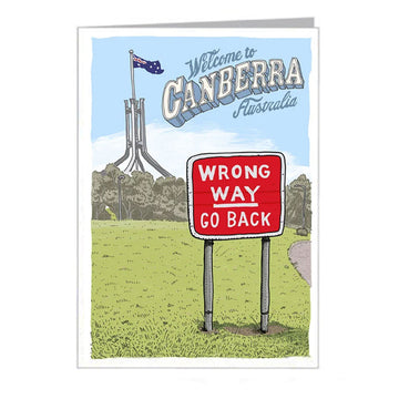 The red sign 'Wrong Way Go Back' is in front of Parliament House and the heading 'Welcome to Canberra Australia'.