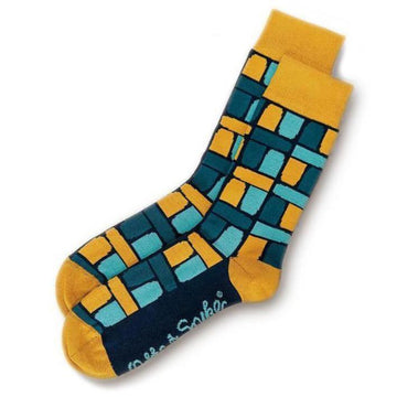 Mustard colours socks pictured featuring a block design in shades of blue.