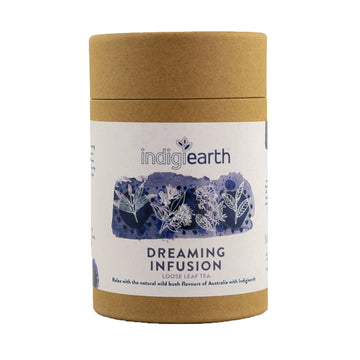A cardboard container with a white product label and the text 'Indigiearth Dreaming Infusion Loose Leaf Tea' visible.