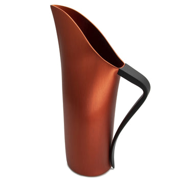 A copper water jug with a long open spout and curved black handle.