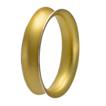 A round bangle with a concave shape in a champagne colour.