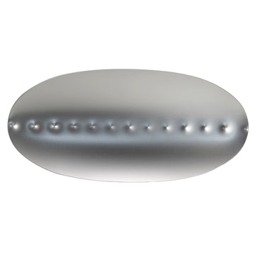 A silver coolamon tray with inverted dots running in a line horizontally.