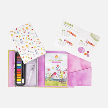 How to Paint Watercolour box cover featuring an illustrated bird and plants with a clear window showing watercolour paints inside.