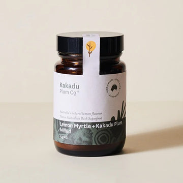 Amber coloured glass jar, black plastic lid, label with indigenous motif. Kakadu Plum Co, Australian Sustainable, Lemon Myrtle and Kakadu plum, printed on label. Logo printed on tamper proof tab.