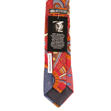 Australian made polyester printed tie. Artwork by Norman cox titled Kanga Story. Brightly coloured mostly red, orange, and blue tones. Connected circles and lines and swirling pattern.