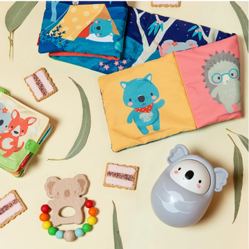 A plastic koala toy in the shape of an egg with ears and a face. There is also printed arms on the front.