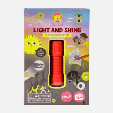 Light and Shine box cover showing a red torch inside the box with illustrations around it of light illusions, shawows and drawings.