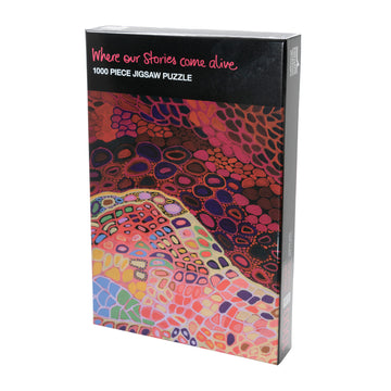 Box with a colourful indigenous artwork depicting corals during the day in a lighter colouring and during the night in a darker tone.